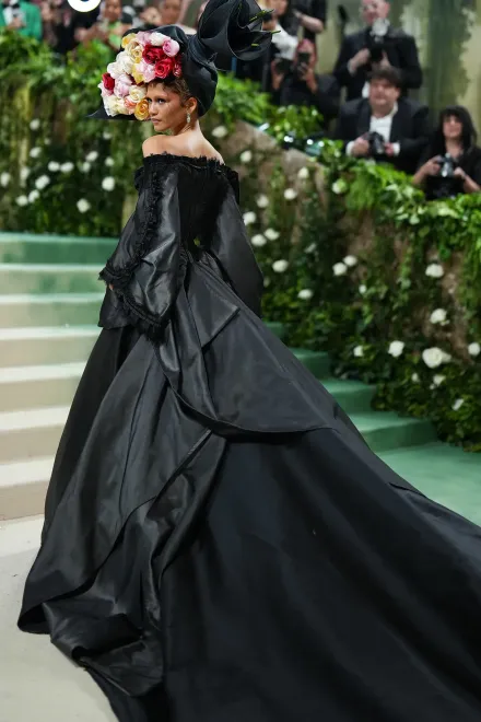 Zendaya in a vintage Givenchy by Galliano dress and a vintage Philip Tracy hat for Alexander McQueen